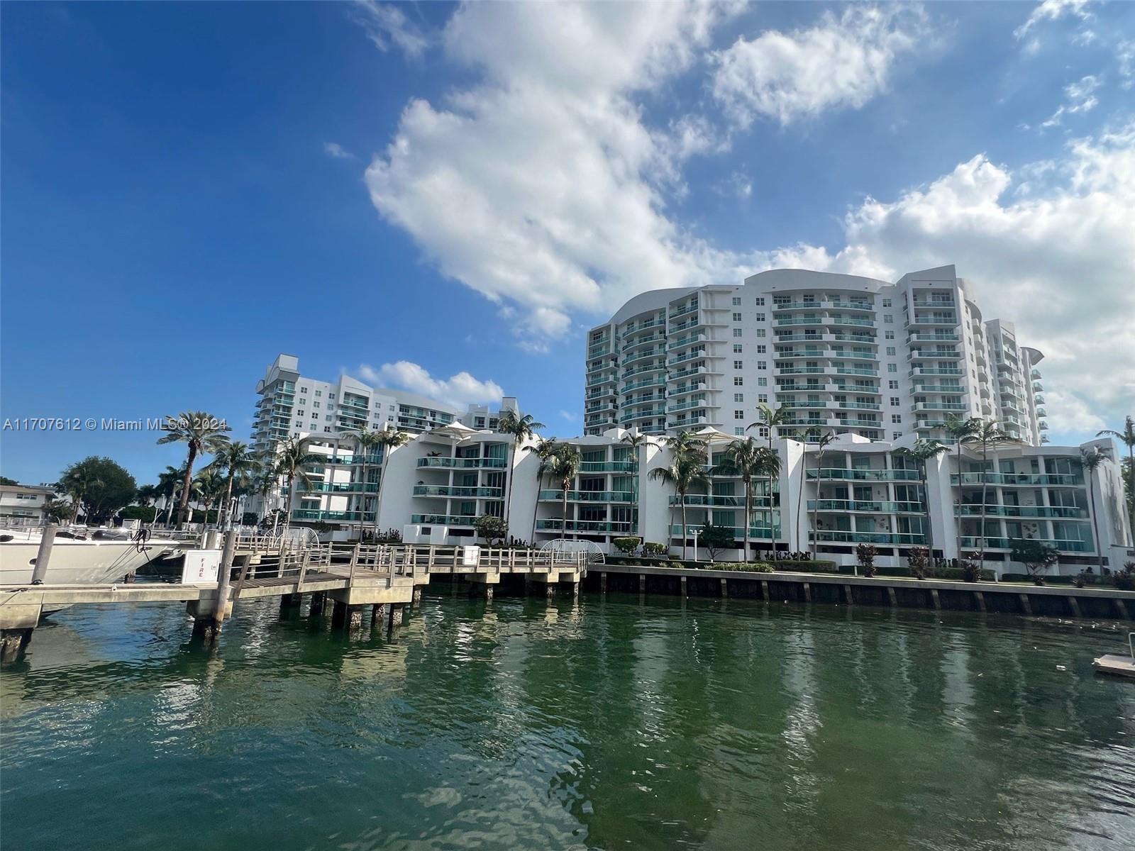 a view of ocean with residential building and lake view