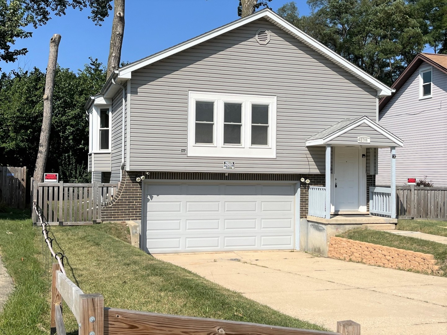 a front view of a house with a garage