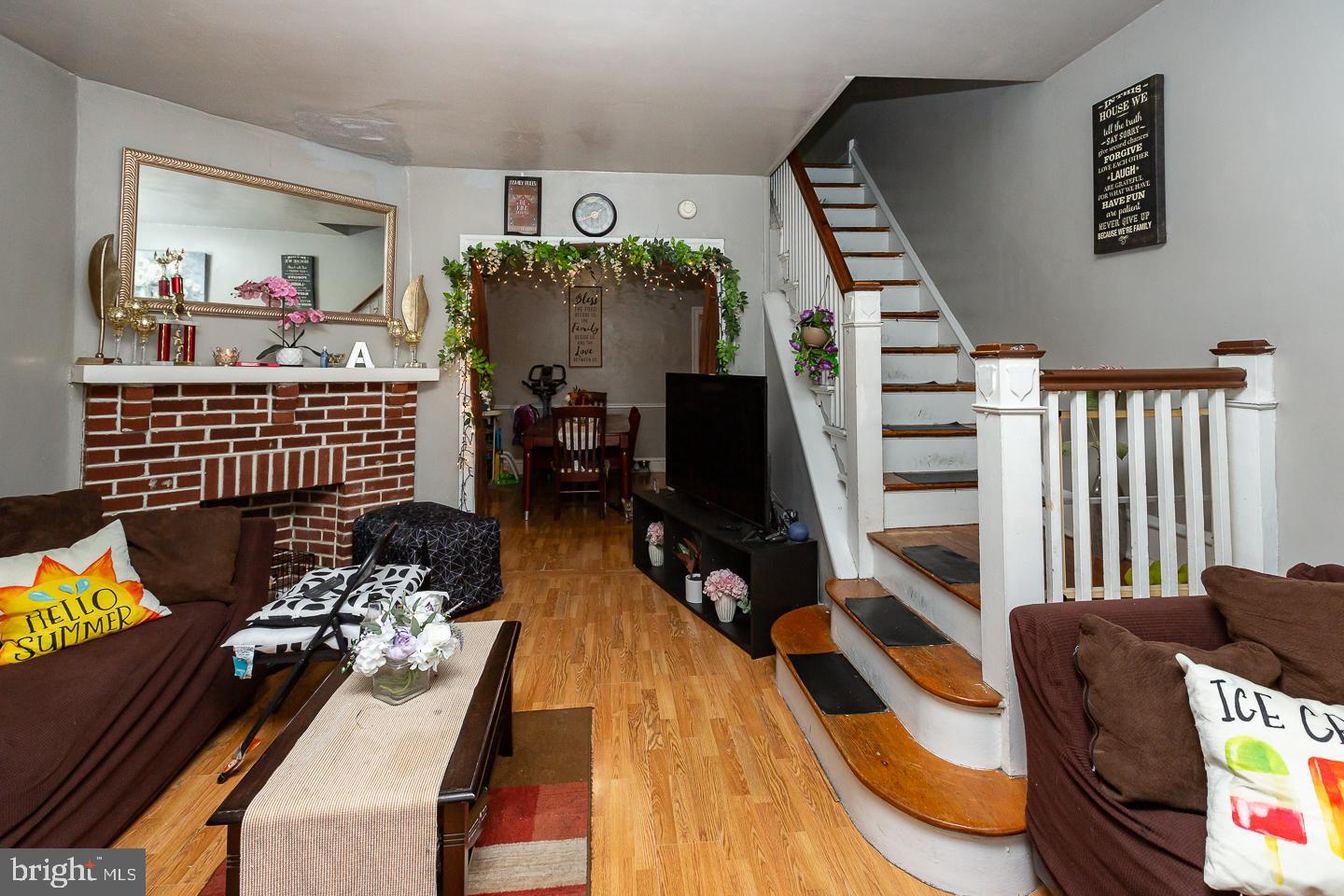 a bedroom with furniture and a wooden floor