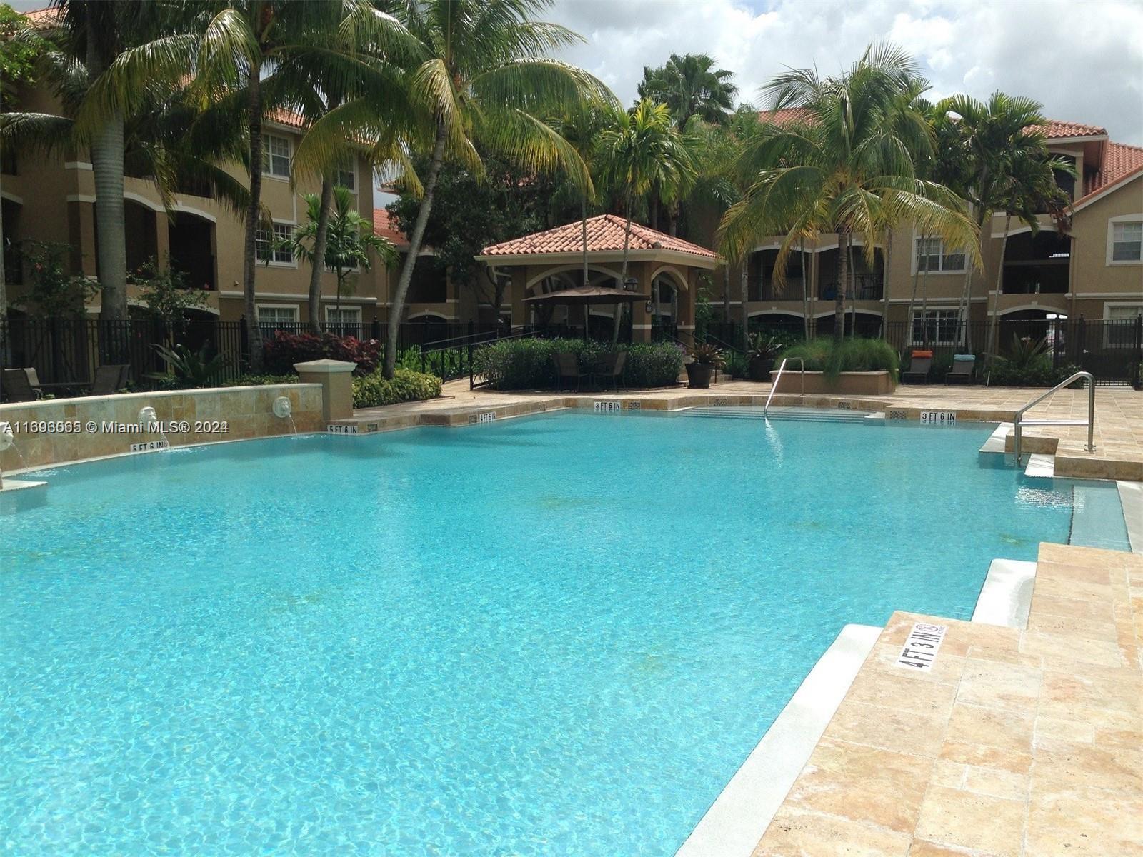 a swimming pool with outdoor seating and yard