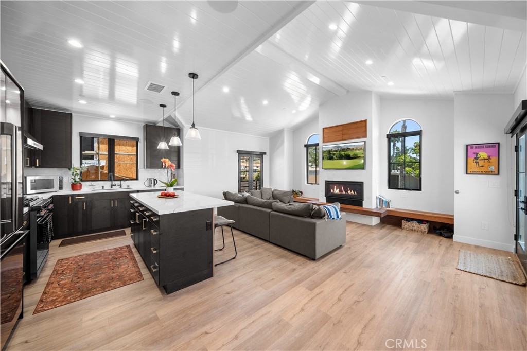 a living room with furniture window and wooden floor