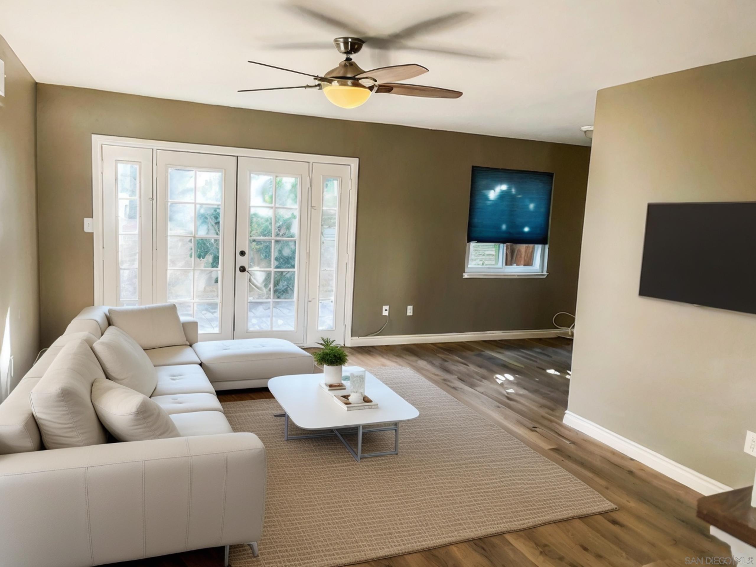 a living room with furniture and a table