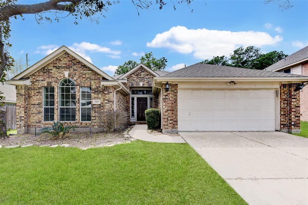 front view of a house with a yard