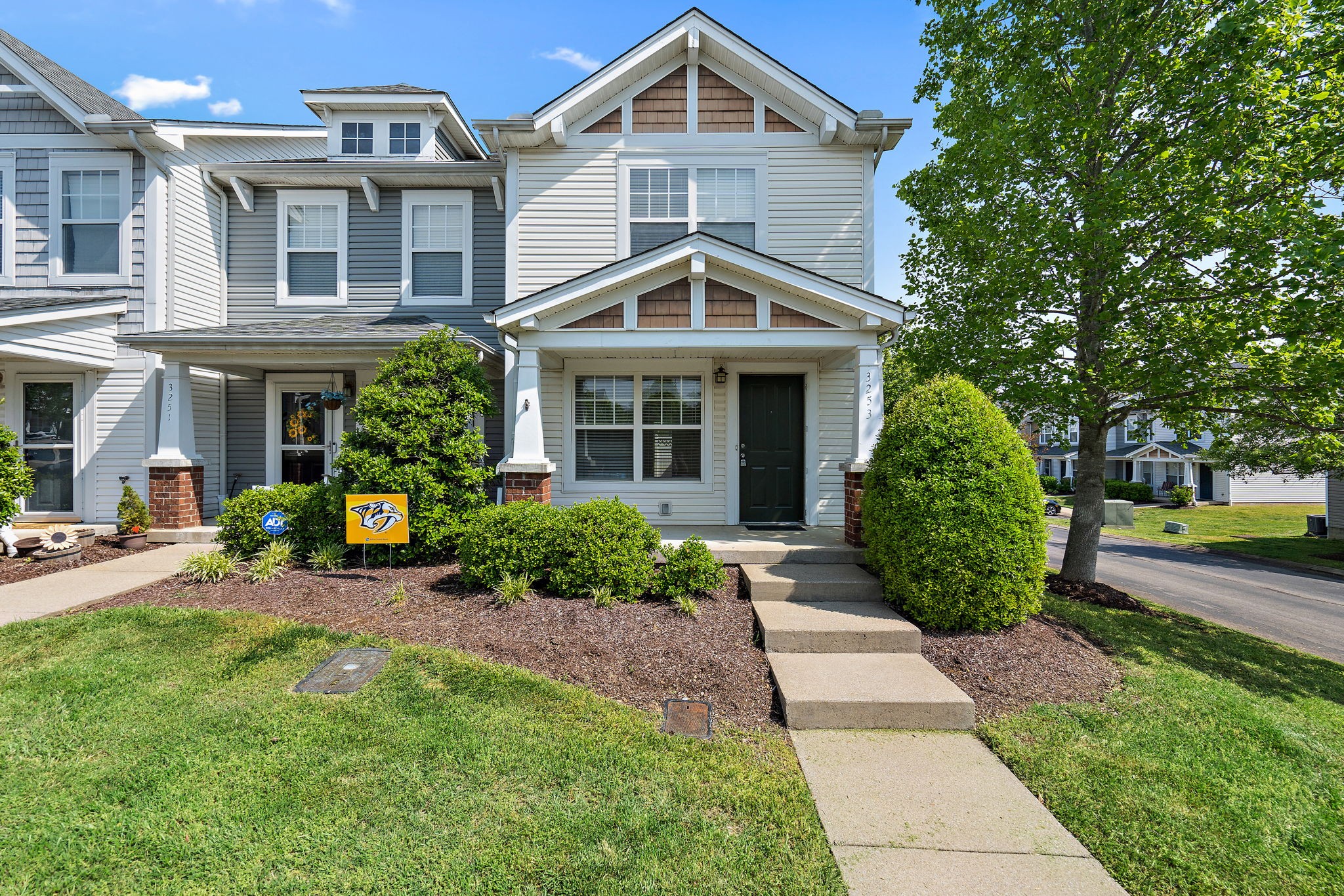 a front view of a house with garden