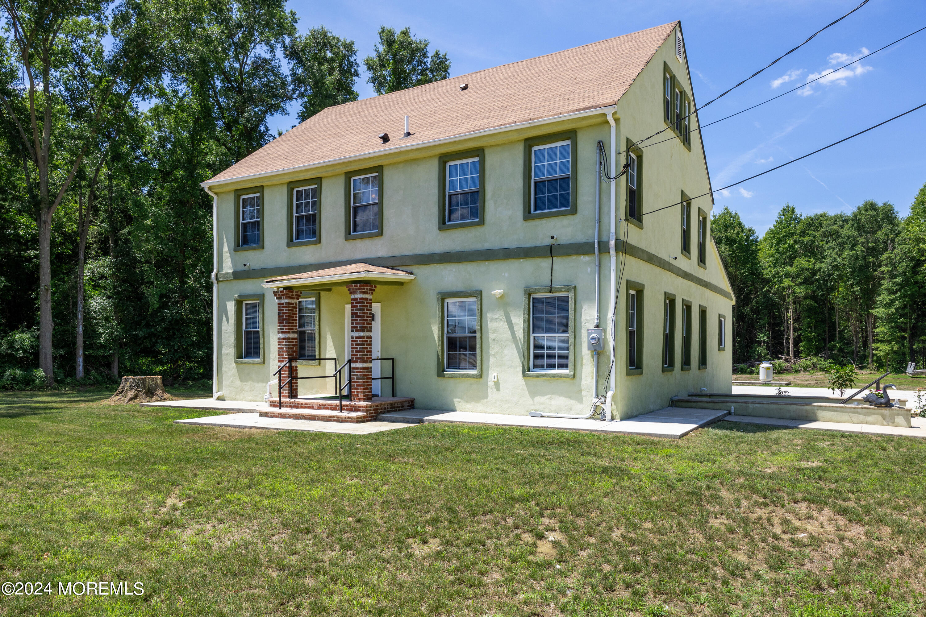 a front view of a house with a yard