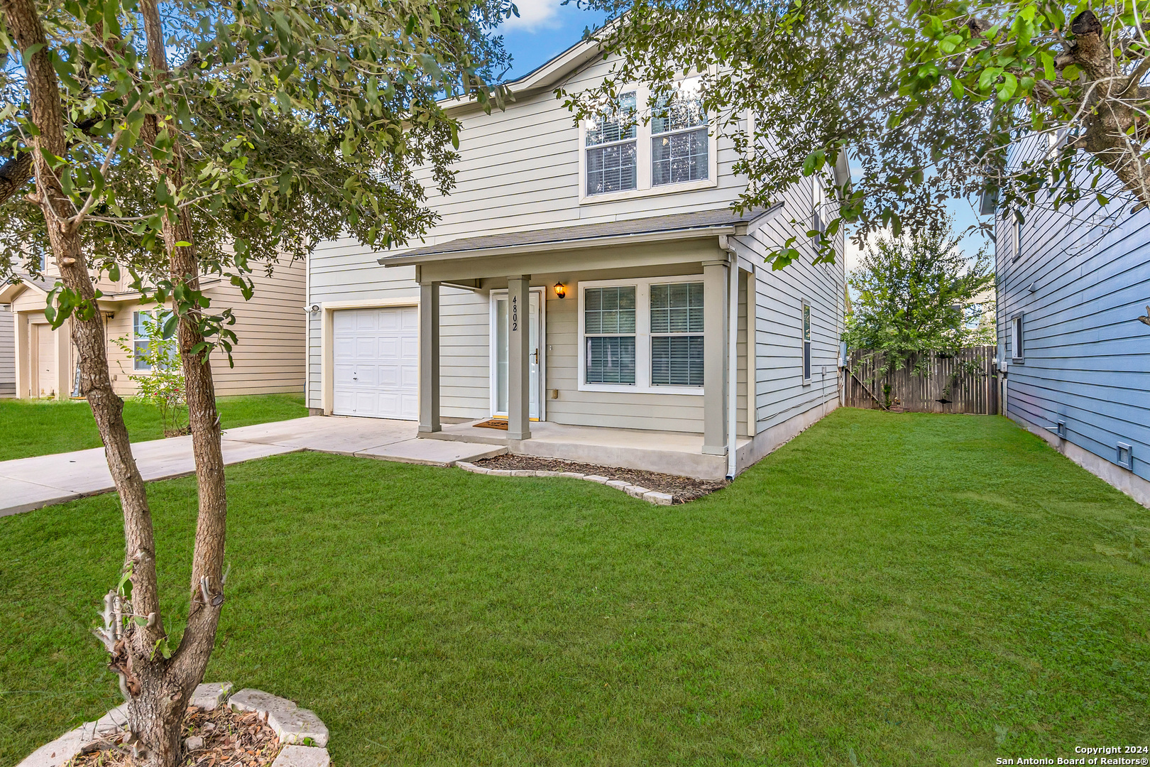 front view of a house with a yard