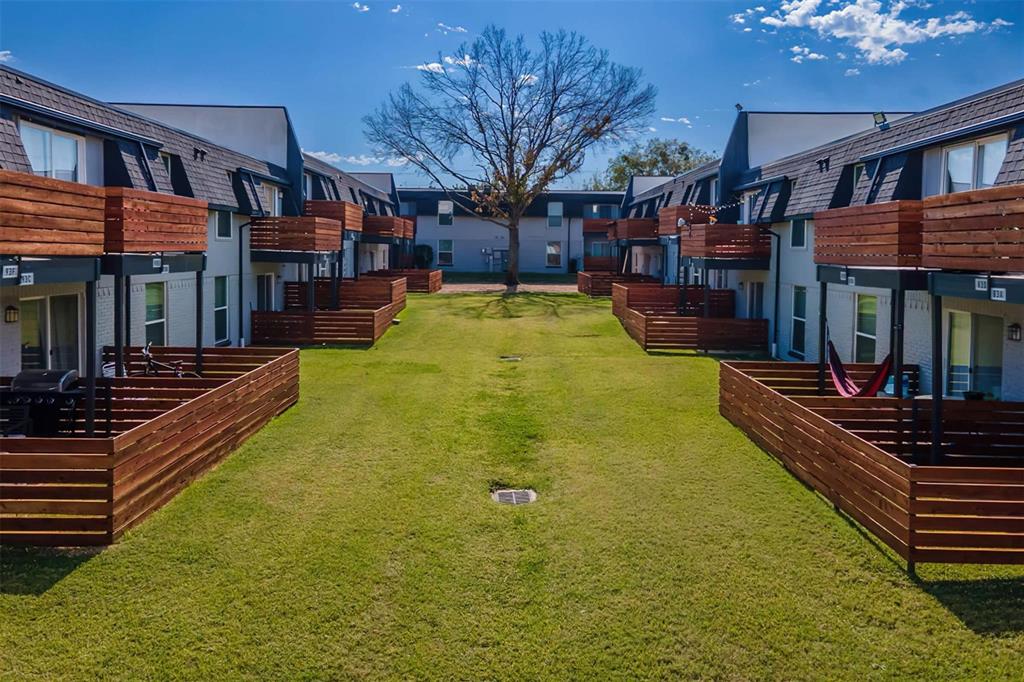 a swimming pool with outdoor seating and yard