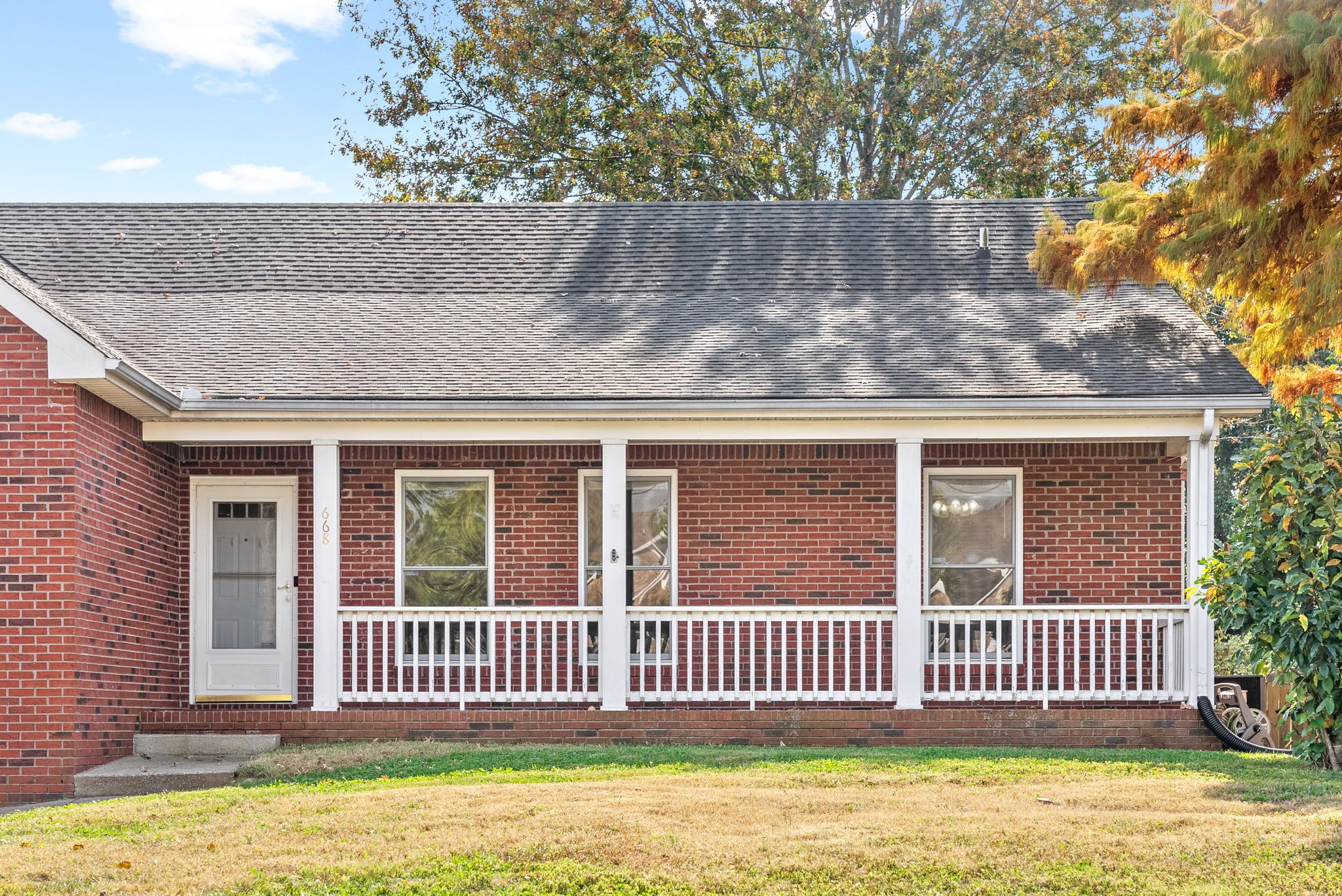 front view of a house with a garden