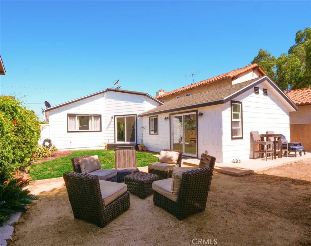 a view of a house with a couches in a patio