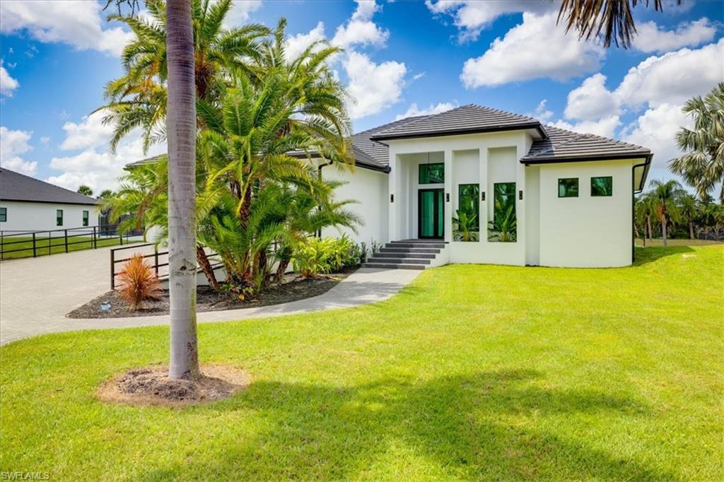 a front view of a house with a yard