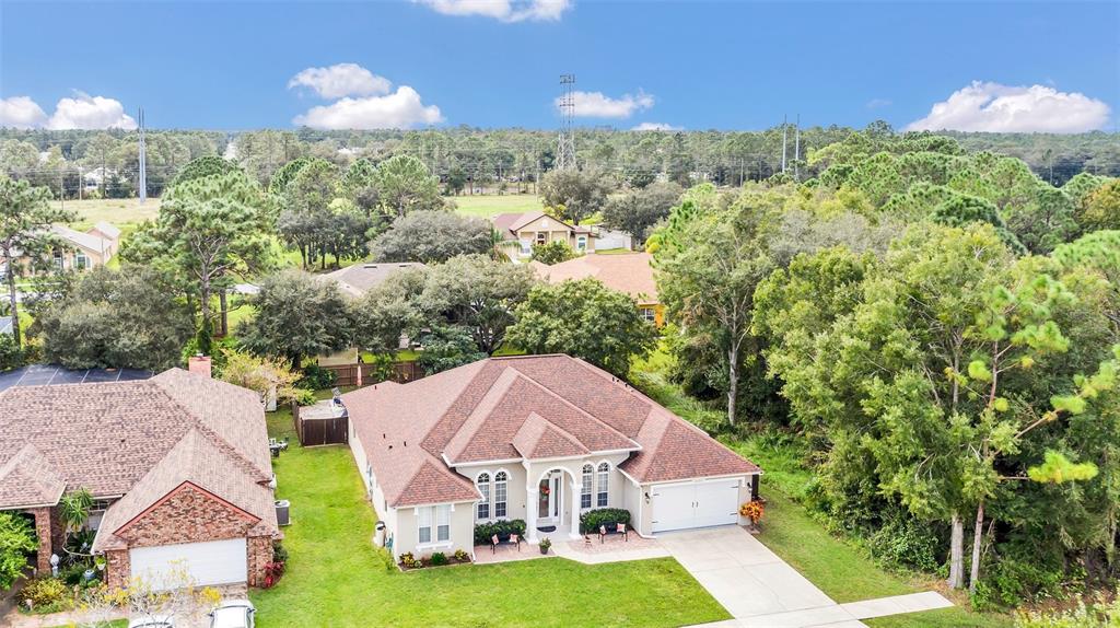 an aerial view of a house with a garden