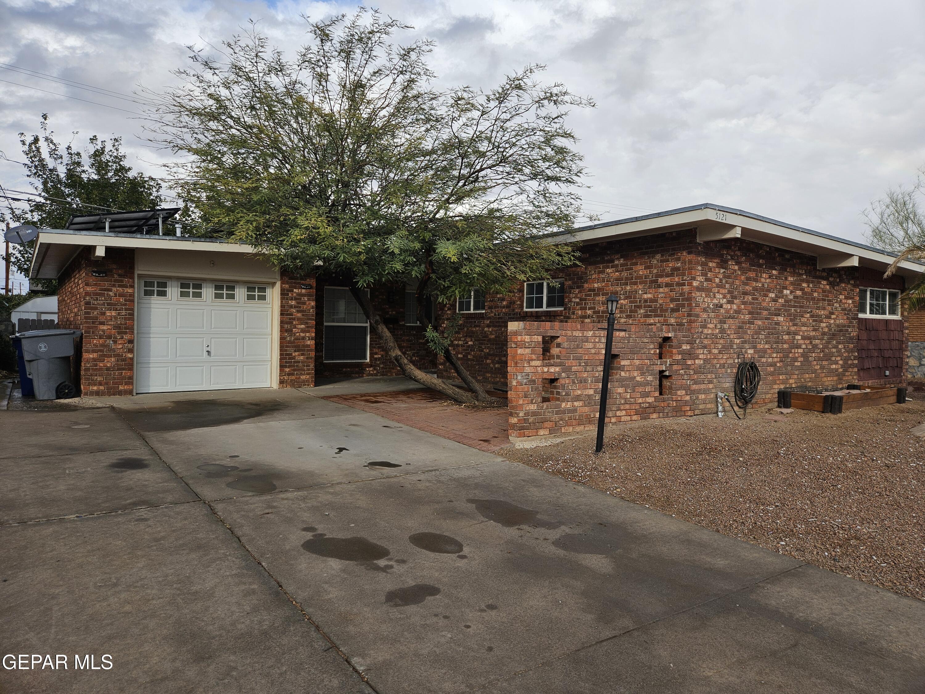 a view of a house with a garage