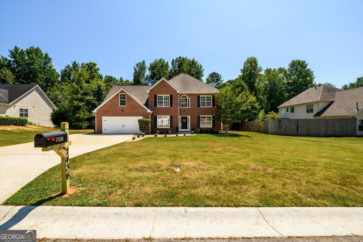 a front view of house with yard