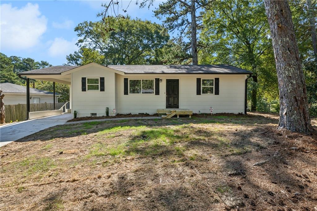 a house with trees in the background