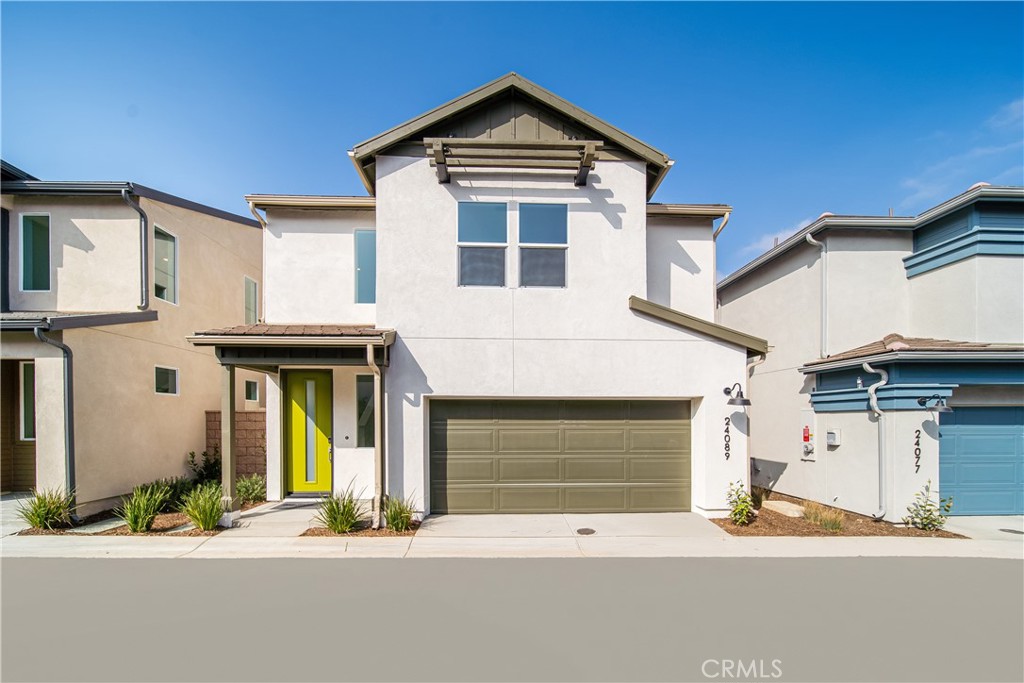 a front view of a house with garage