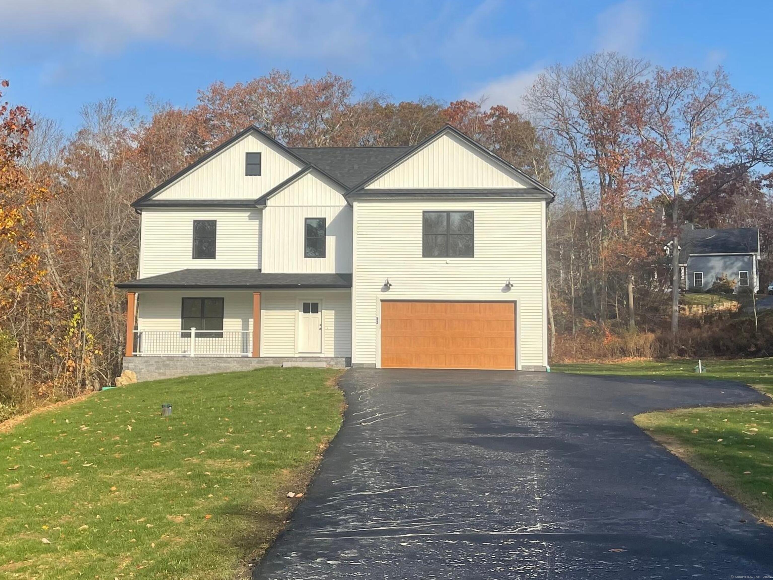 a front view of a house with yard