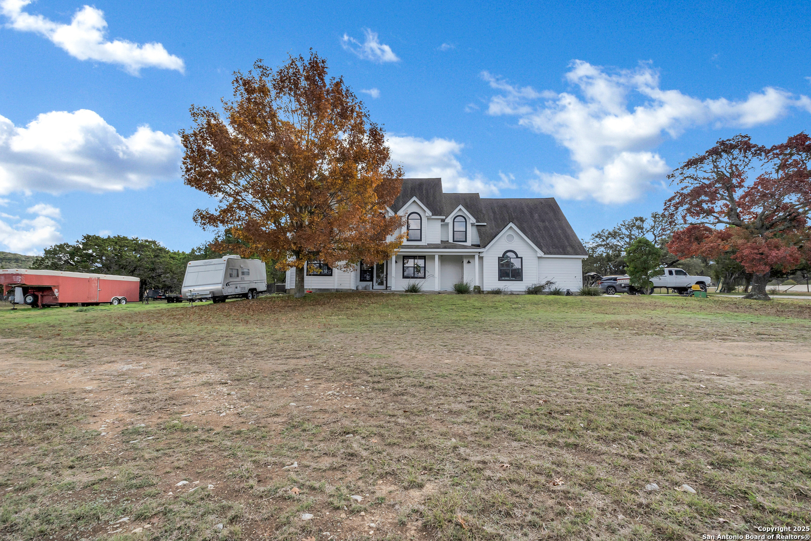 a view of a house with a yard