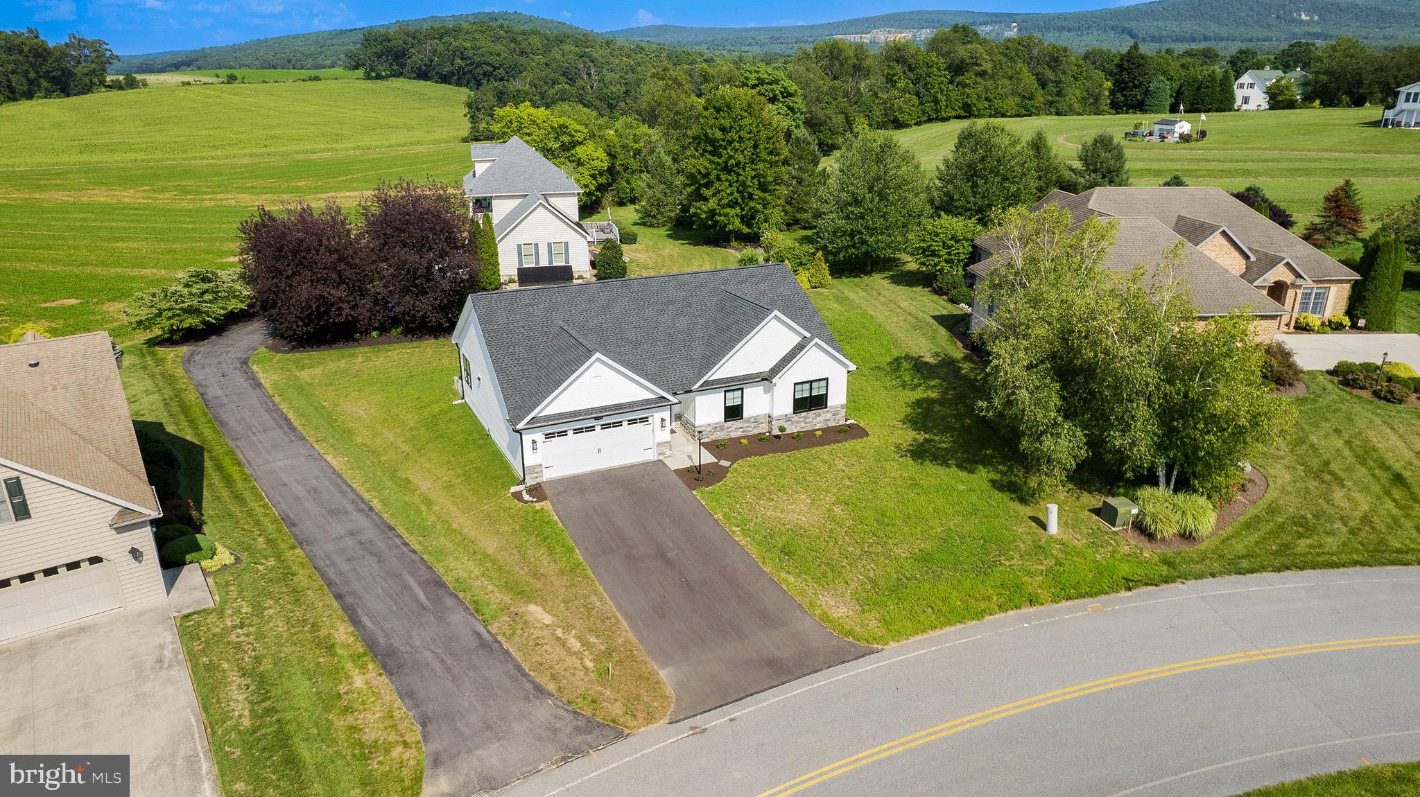 an aerial view of a house with a garden