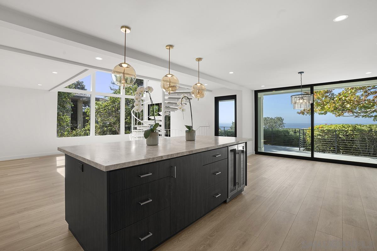 a kitchen with a sink a counter top space and a window