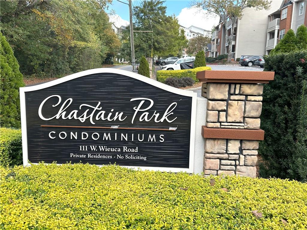 a view of outdoor space with signage and flags