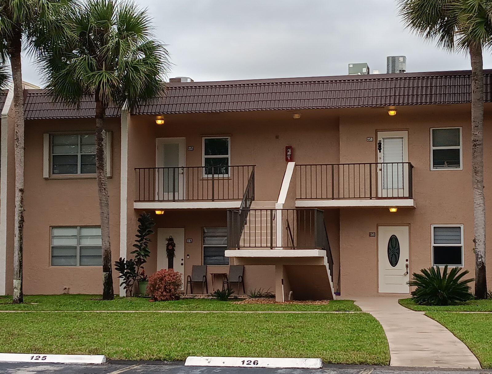 a front view of house with yard and entertaining space