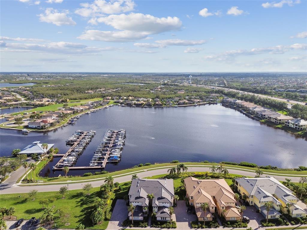 an aerial view of a house with a lake view