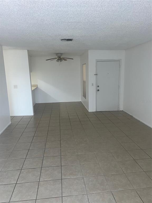 a view of a livingroom with an empty space and a sink