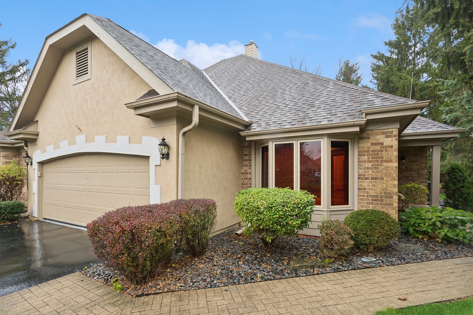 a front view of a house with garden