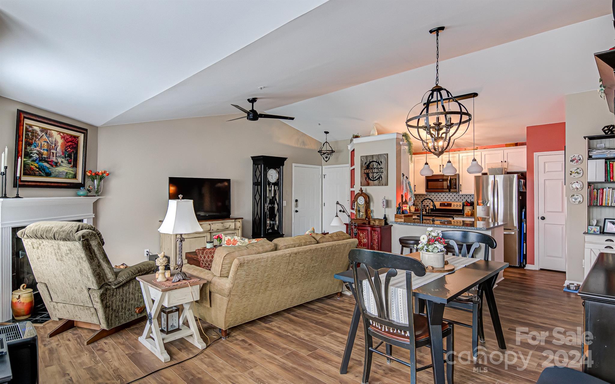 a living room with lots of furniture and a chandelier