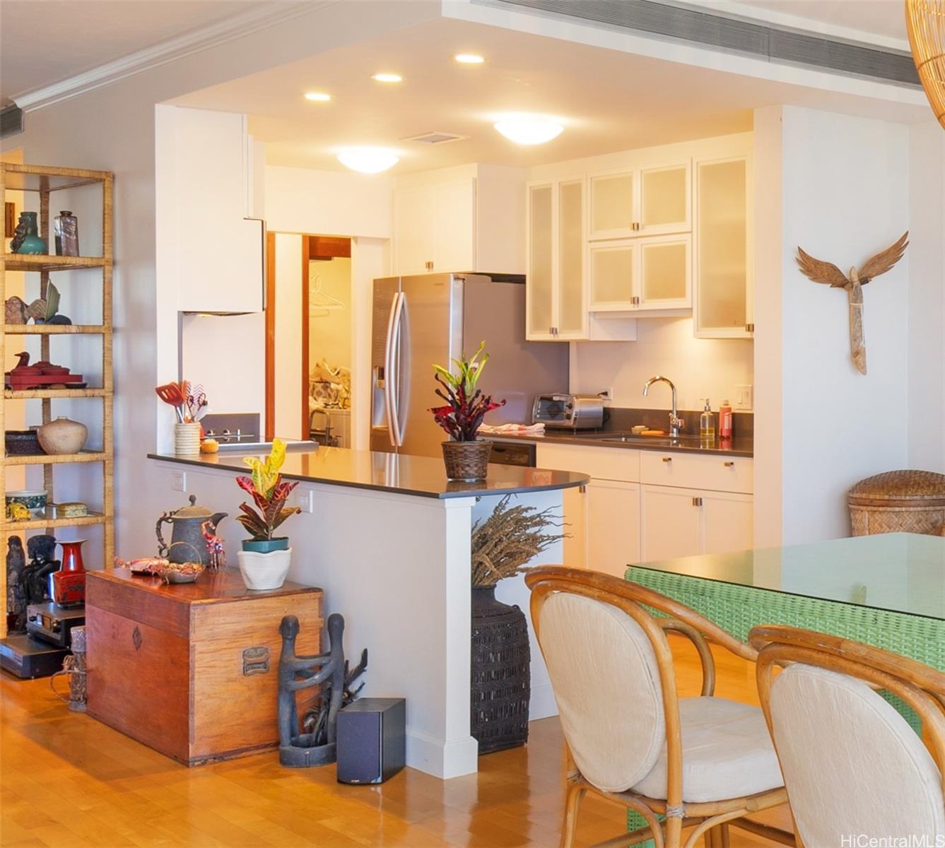 a dining room with furniture and a floor to ceiling window