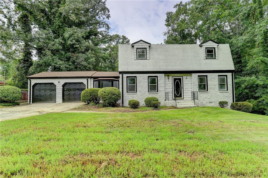 front view of a house with a yard