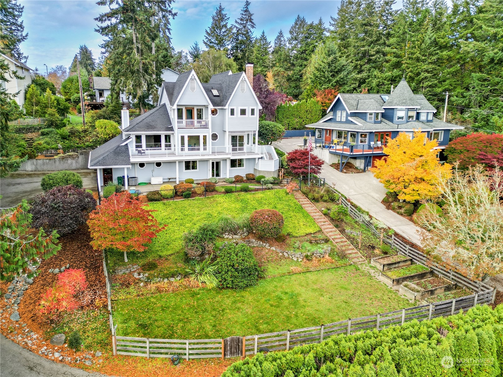 an aerial view of a house with swimming pool garden and patio