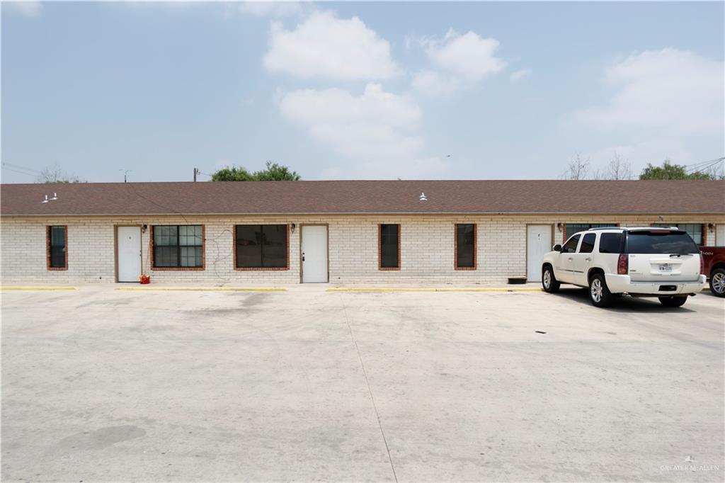 front view of a house with a car parked