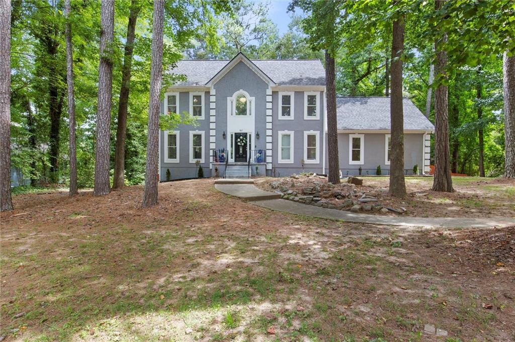 a front view of a house with a yard