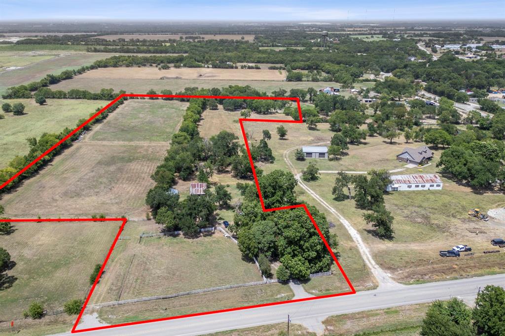 an aerial view of a houses with outdoor space