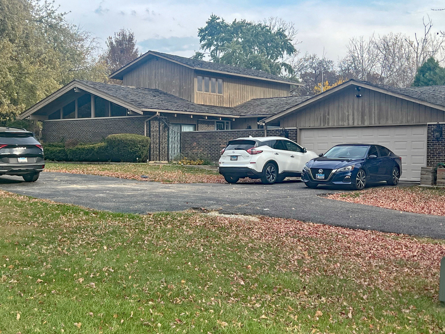 a view of a car parked in front of a house