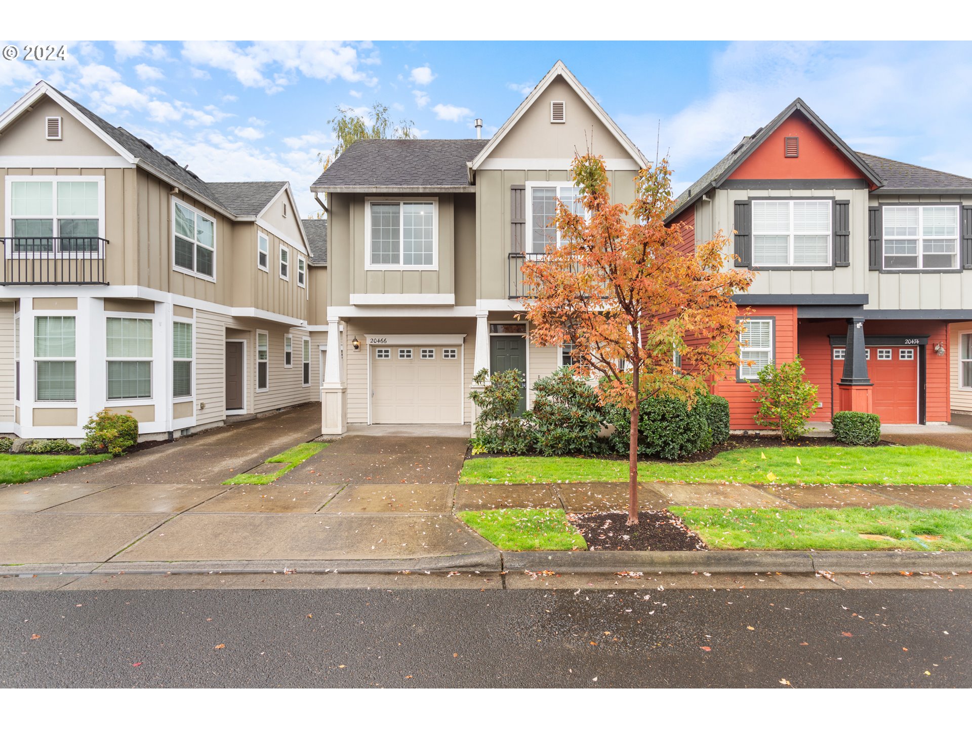 a view of multiple houses with a yard