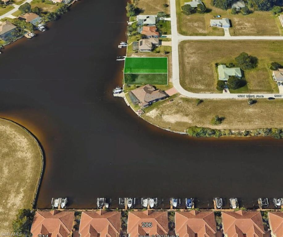 an aerial view of a house with a yard basket ball court