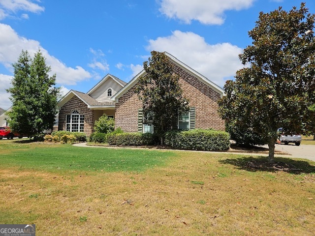 a front view of a house with a yard