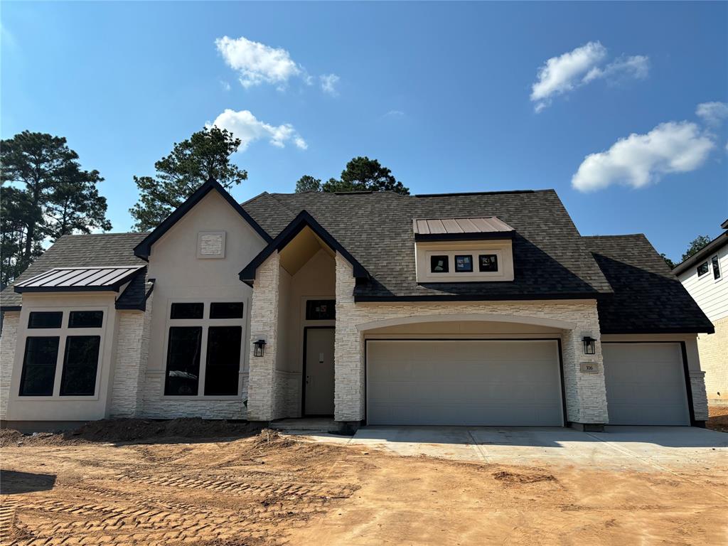 a view of a house with a garage