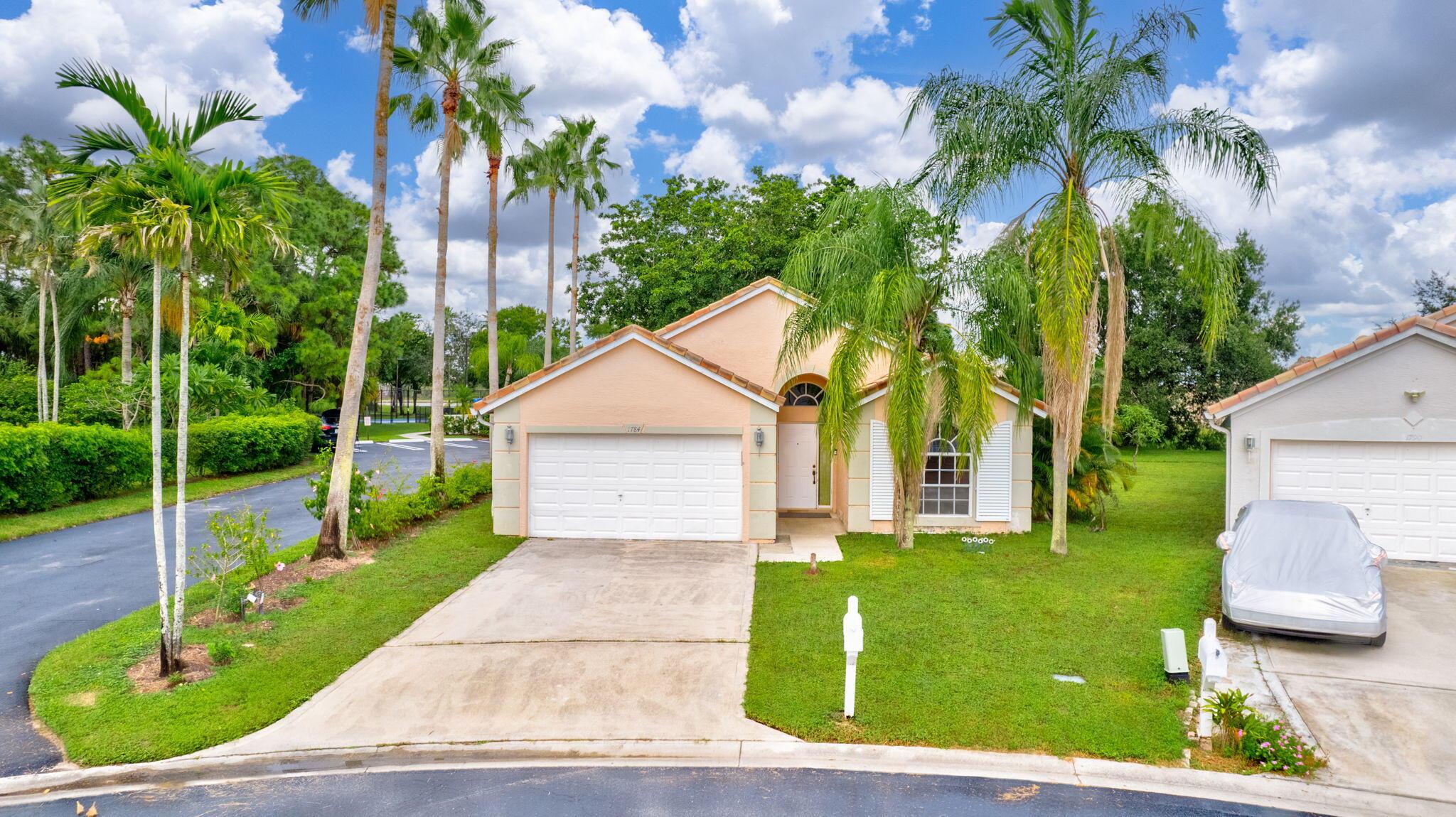 a front view of a house with garden