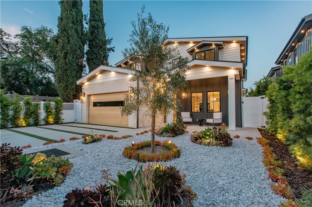 a front view of house with yard outdoor seating and barbeque oven