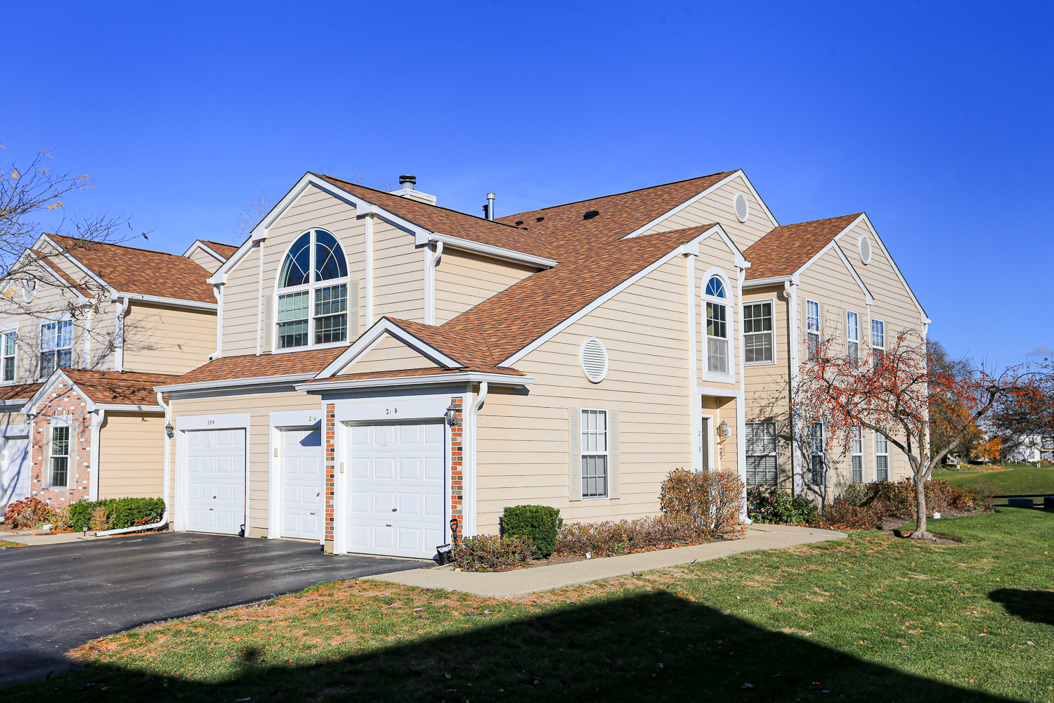 a front view of a house with a yard