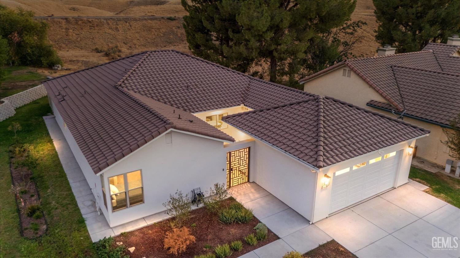 a aerial view of a house with a yard