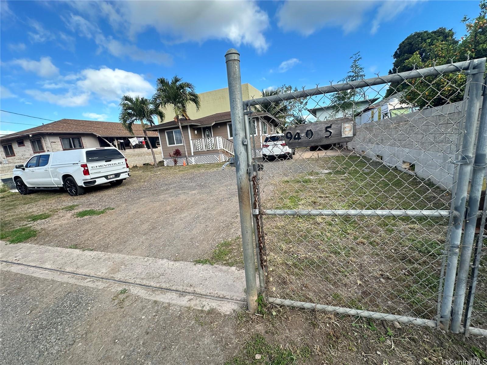 a view of a car park in front of house