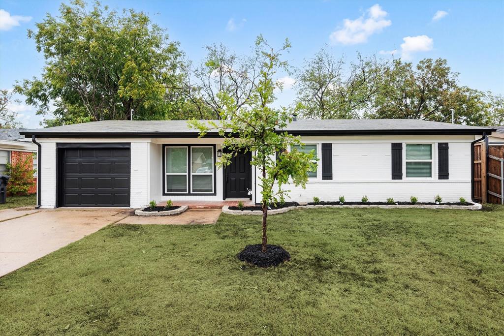 a house view with a garden space