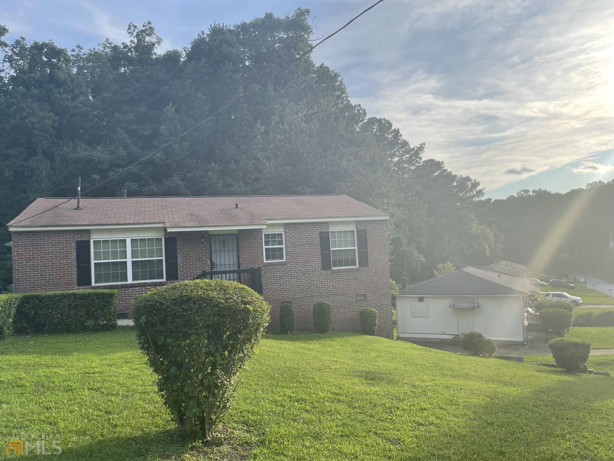 a view of house with backyard