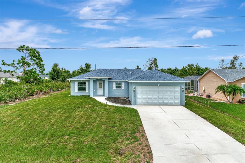 front view of a house with a yard