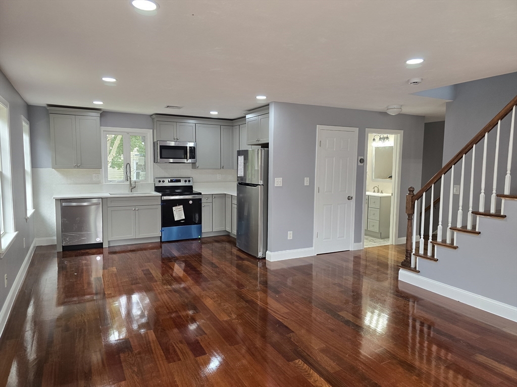 a view of kitchen with cabinets and stainless steel appliances