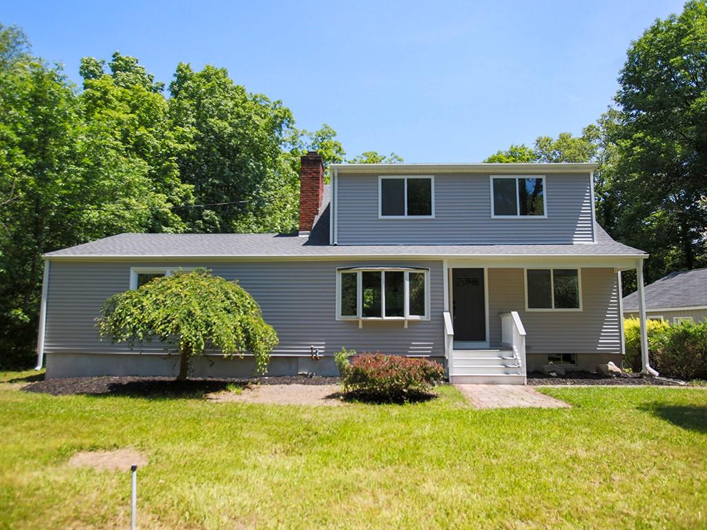 Front of property with a front lawn set back from the road.